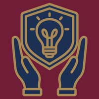 Intellectual property protection icon with hands holding a shield and light bulb.